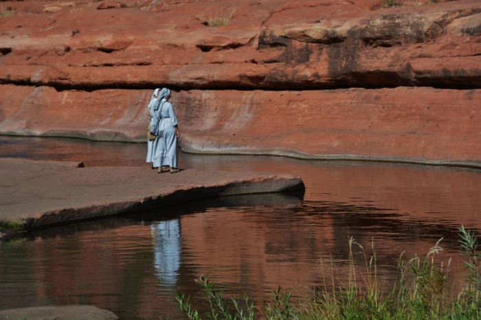 two nuns at creek's edge
